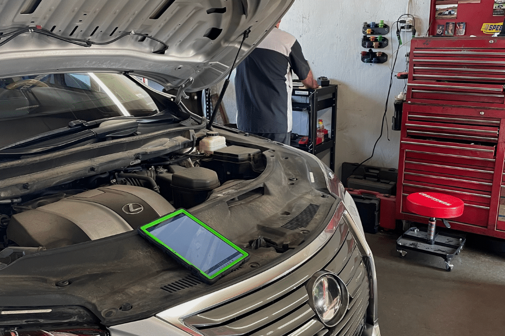 Back-to-School Vehicle Inspection in Republic, MO At Yocum Automotive. Mechanic performing a back-to-school vehicle safety inspection